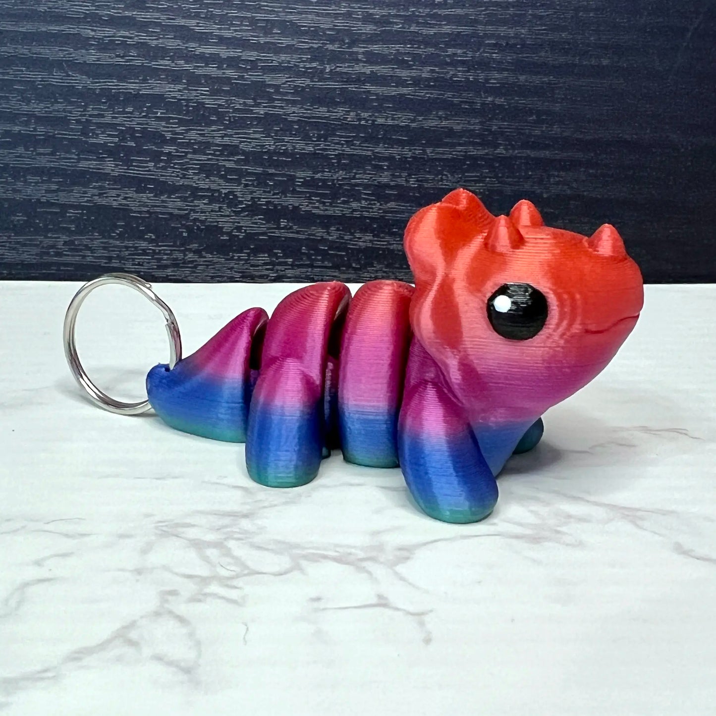 Cute Triceratops Keychain in Fantasy Rainbow