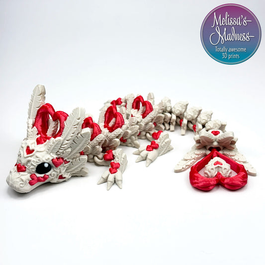Heart Light Baby Dragon in Aged White & Silk Red articulated figurine wholesale retail store gift shop display