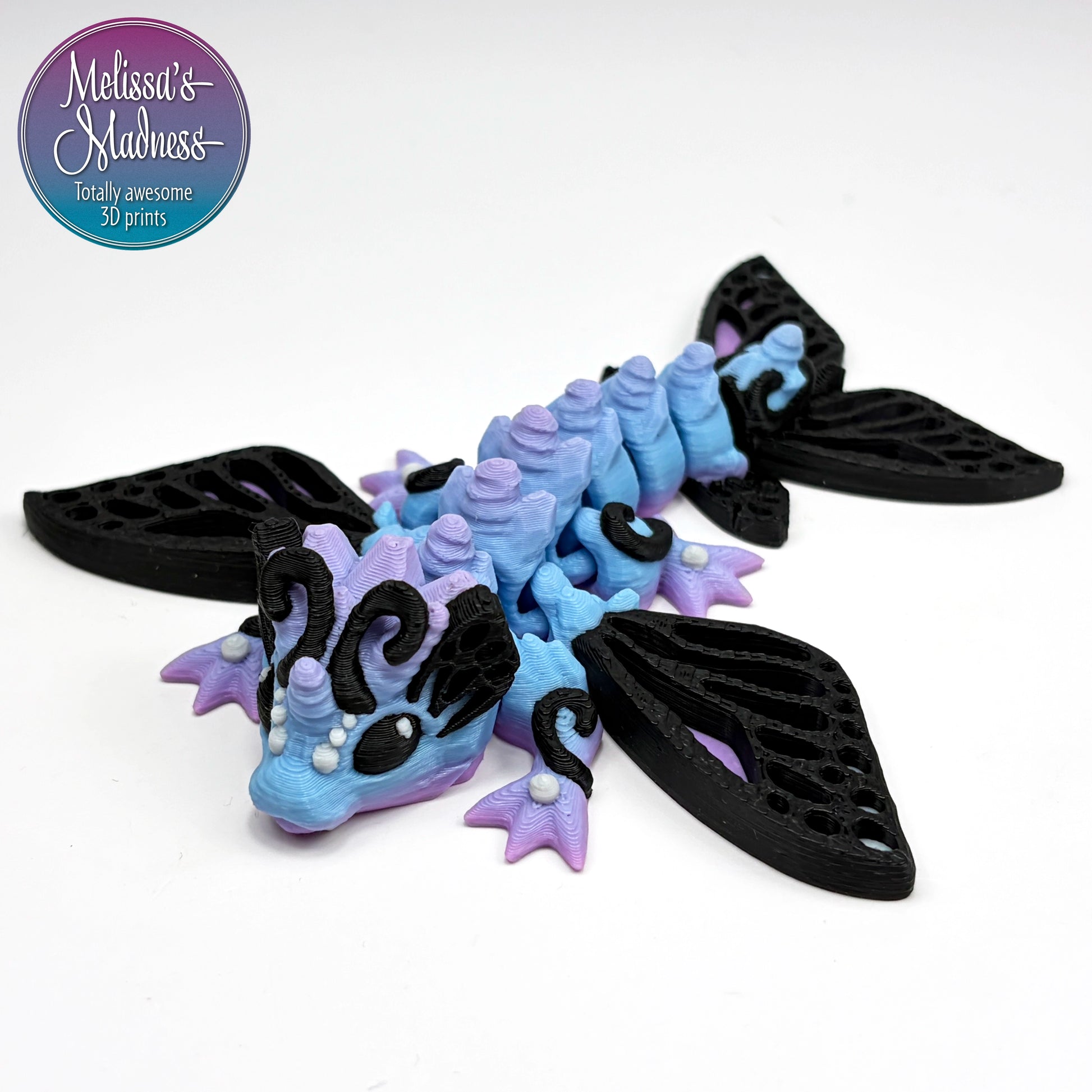 Tiny Butterfly Dragon in Cotton Candy Made in Montana woman-owned handcrafted articulated figurine