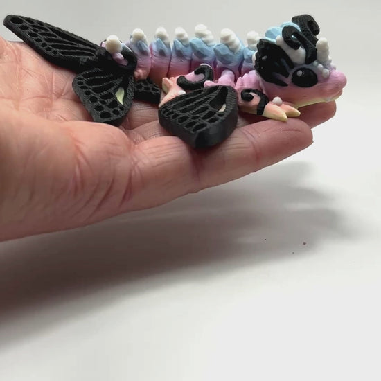 Articulated Tiny Butterfly Wyvern in Pastel Spectrum Flexi Fidget Collectible Demonstrating Full Range of Motion 3D Printed