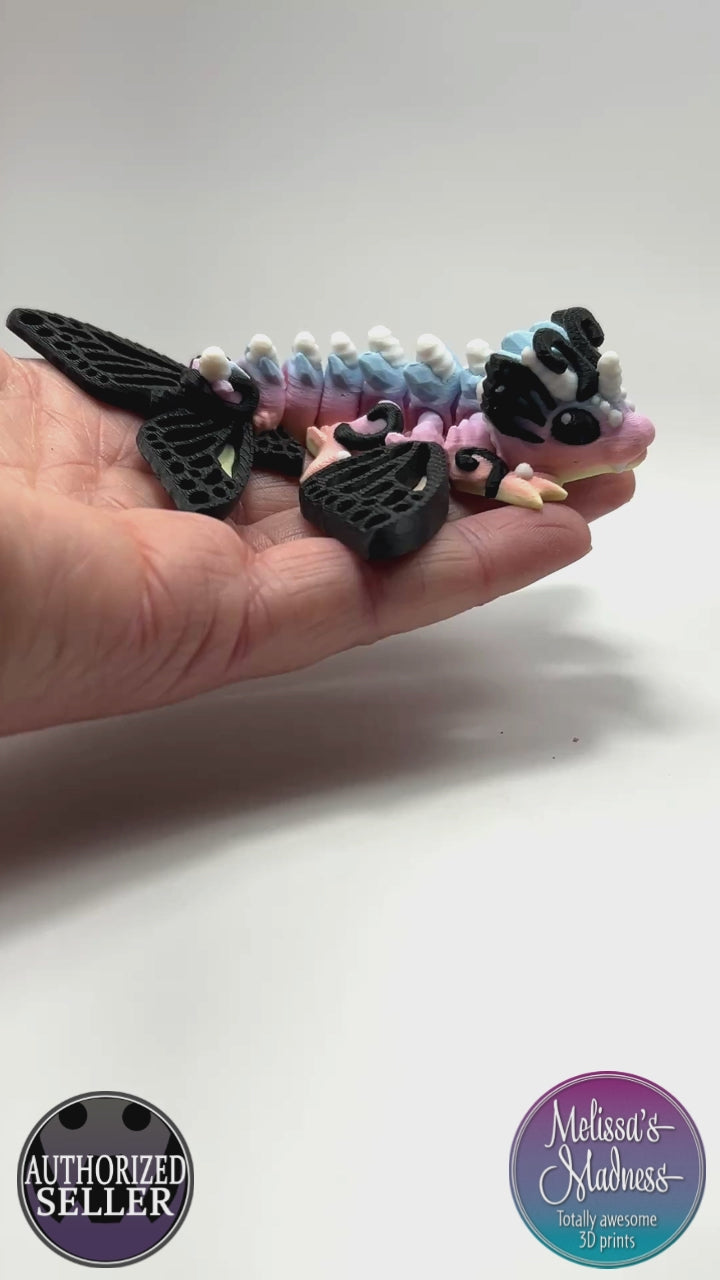 Articulated Tiny Butterfly Wyvern in Pastel Spectrum Flexi Fidget Collectible Demonstrating Full Range of Motion 3D Printed