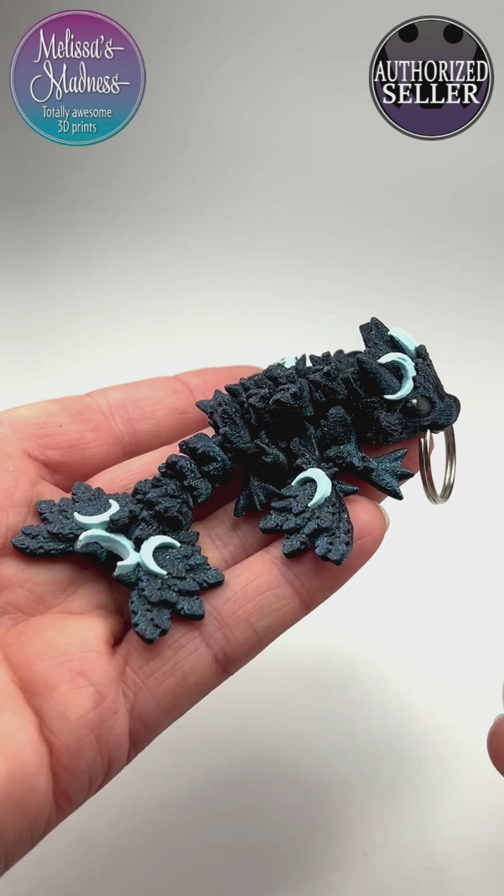 Eco-Friendly Tiny Lunar Dragon Keychain in In the Deep & Ice Blue Flexi Figurine Demonstrating Joint Movement Biodegradable PLA