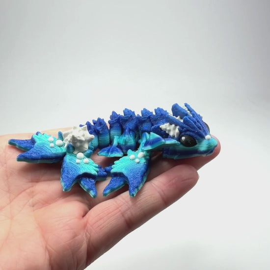 Articulated Tiny Ocean Dragon in Ocean & Aged White biodegradable PLA model flexibility demonstration eco-friendly hydropower made