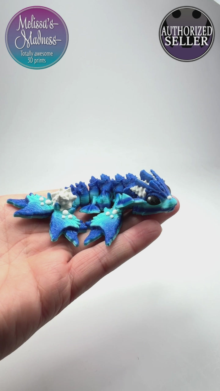 Articulated Tiny Ocean Dragon in Ocean & Aged White biodegradable PLA model flexibility demonstration eco-friendly hydropower made