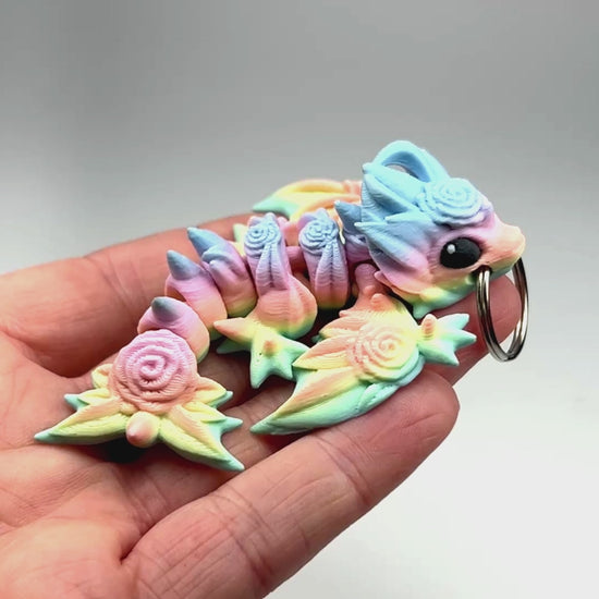 Articulated Tiny Rose Wyvern Keychain in Pastel Spectrum Biodegradable PLA Model Flexibility Demonstration Eco-Friendly Hydropower Made