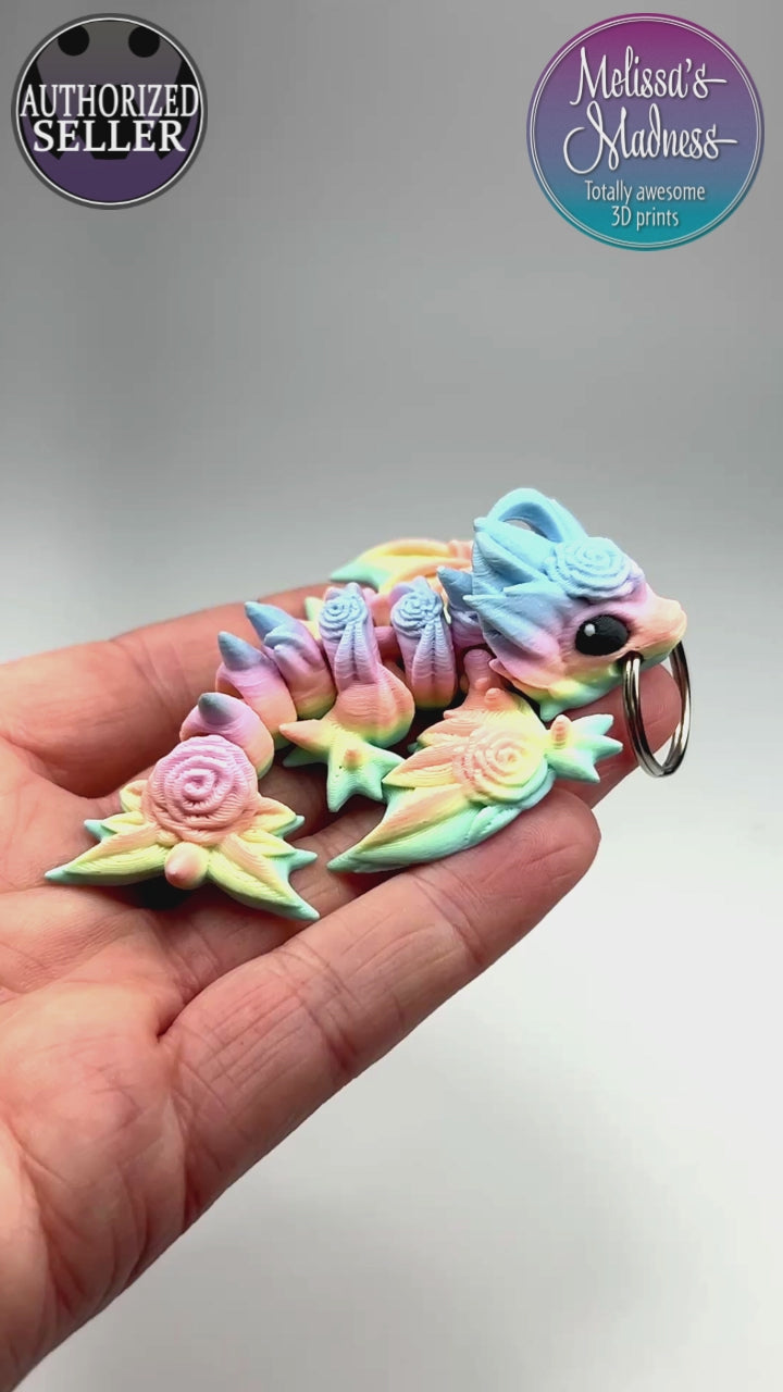 Articulated Tiny Rose Wyvern Keychain in Pastel Spectrum Biodegradable PLA Model Flexibility Demonstration Eco-Friendly Hydropower Made