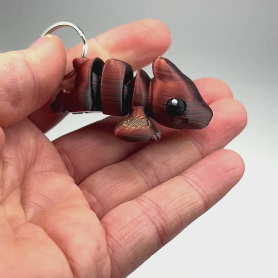 Wholesale Cute Pterodactyl Chunky Keychain in Gold+Copper+Black Shifting Articulated Figurine Demonstrating Flexibility Museum Store Display