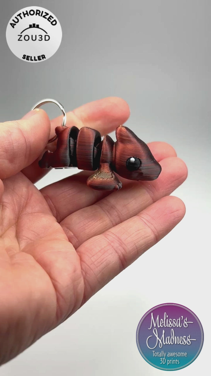 Wholesale Cute Pterodactyl Chunky Keychain in Gold+Copper+Black Shifting Articulated Figurine Demonstrating Flexibility Museum Store Display